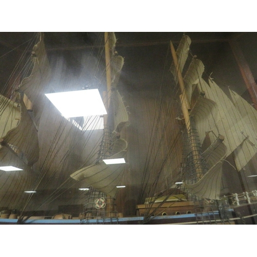 79 - A model of a tall sail ship in a bespoke glass display case