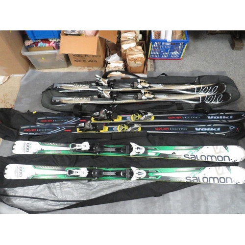 133 - Three pairs of skis with carry bags