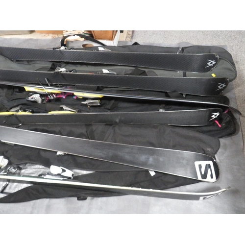 133 - Three pairs of skis with carry bags