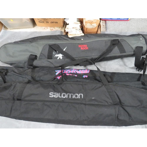 133 - Three pairs of skis with carry bags