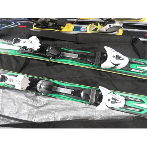 133 - Three pairs of skis with carry bags