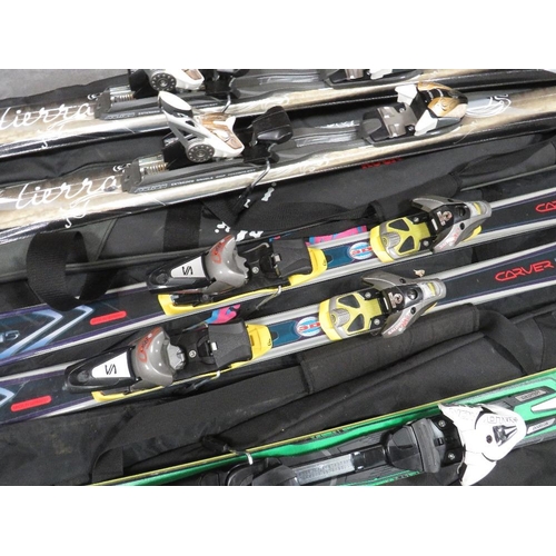 133 - Three pairs of skis with carry bags