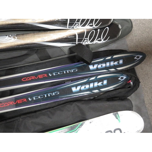 133 - Three pairs of skis with carry bags