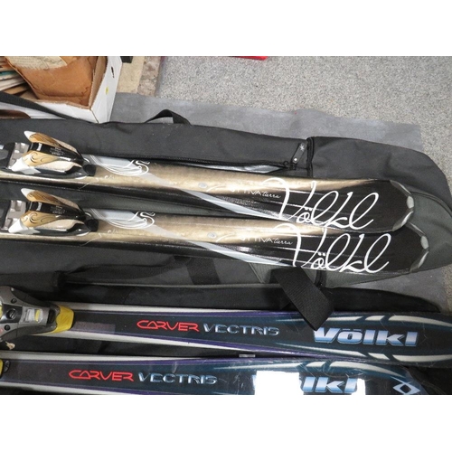 133 - Three pairs of skis with carry bags