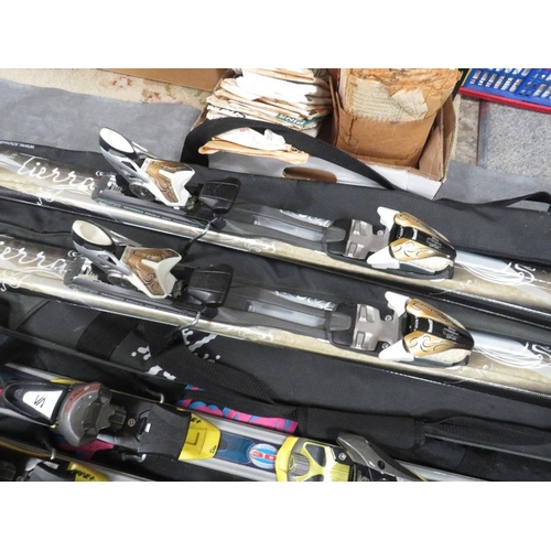 133 - Three pairs of skis with carry bags