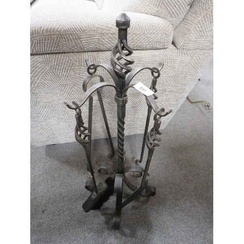 237 - A wrought iron companion set