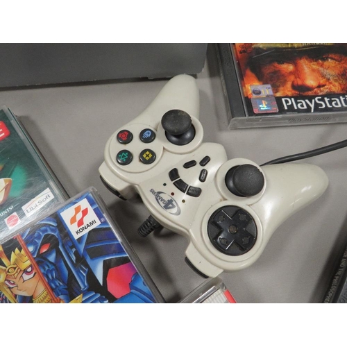 257 - A boxed PlayStation PS One with hand controller with 22 games (unchecked)