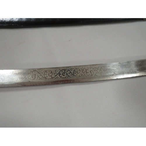 262 - A vintage dress sword etched made in India