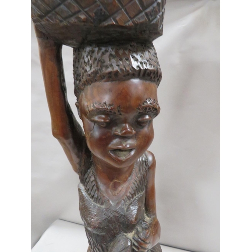 271 - A large carved treen figure of an African lady