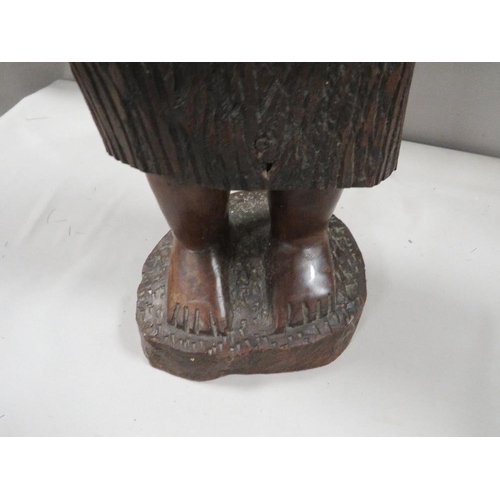 271 - A large carved treen figure of an African lady