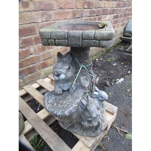 604 - Three concrete garden statues to include a bust and a birdbath