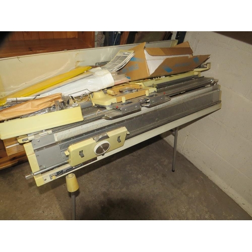 645 - An Empisal knitmaster knitting machine and table