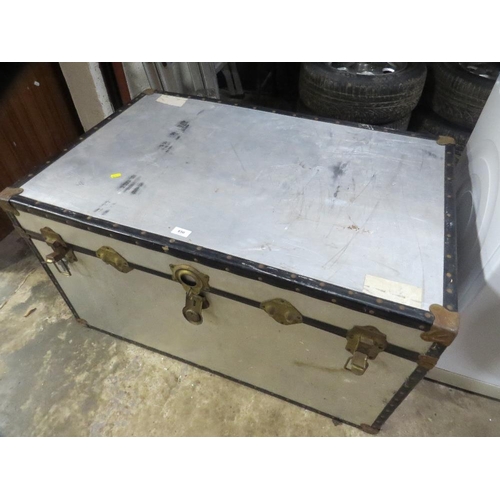 650 - An aluminium travel trunk and a smaller travel trunk