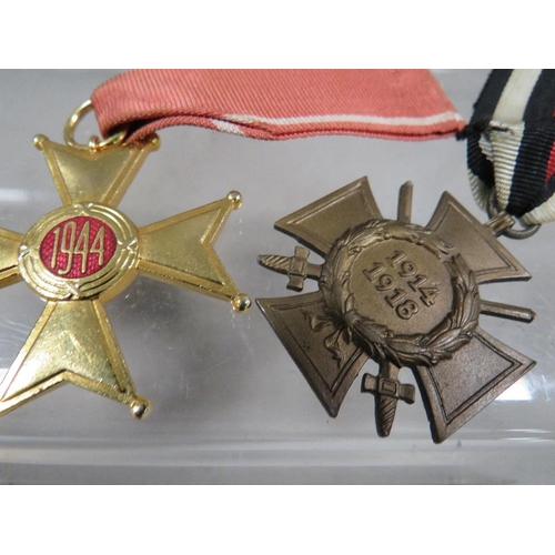 438 - A Poland Knight cross medal and two other medals