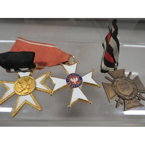 438 - A Poland Knight cross medal and two other medals