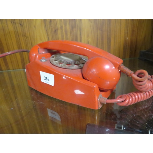 283 - A vintage red telephone