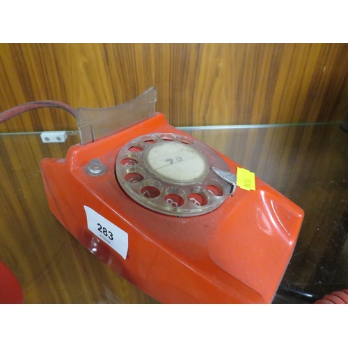 283 - A vintage red telephone