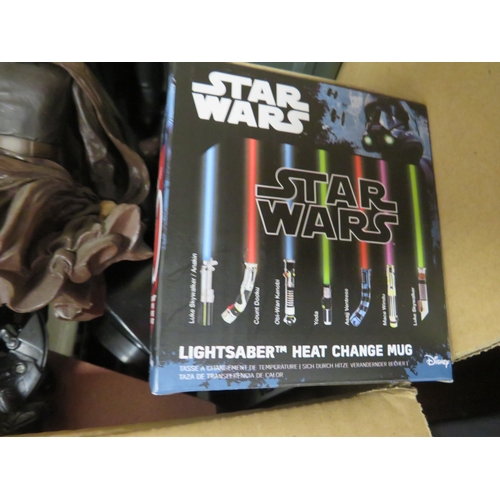 277 - A tray of unboxed Star Wars figures to include Darth Mack and Dark Vader, books, mug, money box etc