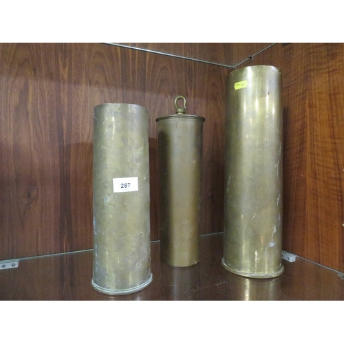 287 - A WW1 1917 trench art shell case gong, along with two large cannon shells (3)