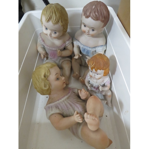 297 - Four vintage porcelain baby figures