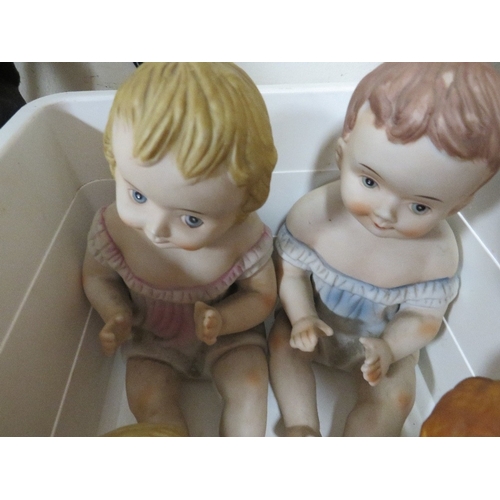 297 - Four vintage porcelain baby figures