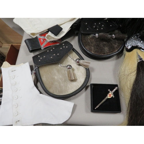 299 - A feather bonnet together with a tray containing a new horsehair sporran, sealskin sporran, pair of ... 