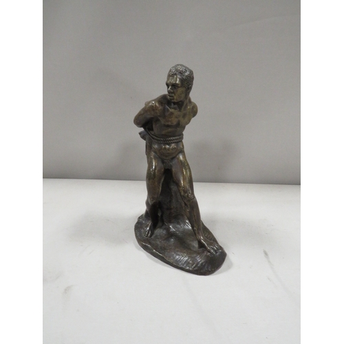 306 - A bronze effect cast figure of a man tied to a tree stump possibly Prometheus ?