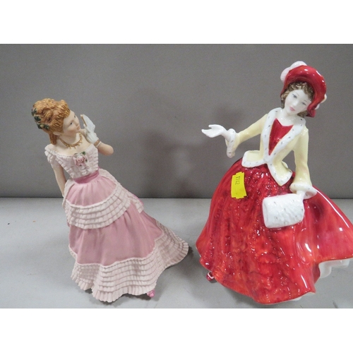 324 - A Royal Doulton figurine Christmas Day 1999 together with a Wedgwood figurine