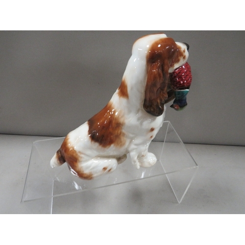 325 - A Royal Doulton figure of a liver and white spaniel carrying a pheasant HN1028 A/F - tail has been r... 