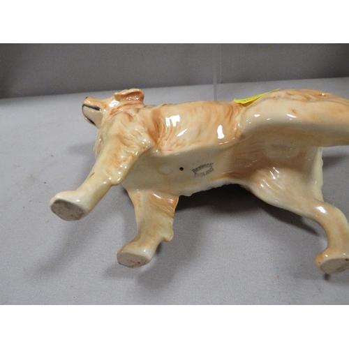 334 - A large Beswick seated cat in white together with a Golden Labrador and a Corgi