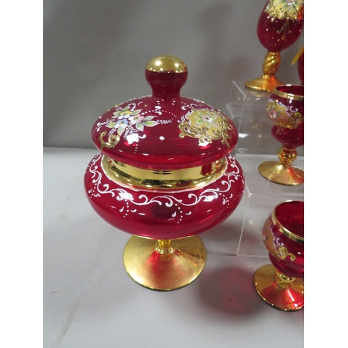 339 - A collection of continental style gilded red glass to include a ewer