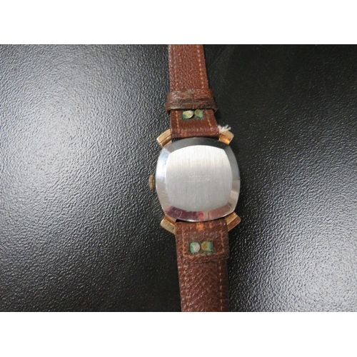 343 - A 1950's Oris gentleman's wristwatch, in square case with fancy lugs, champagne dial, with baton mar... 