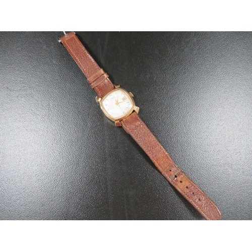 343 - A 1950's Oris gentleman's wristwatch, in square case with fancy lugs, champagne dial, with baton mar... 