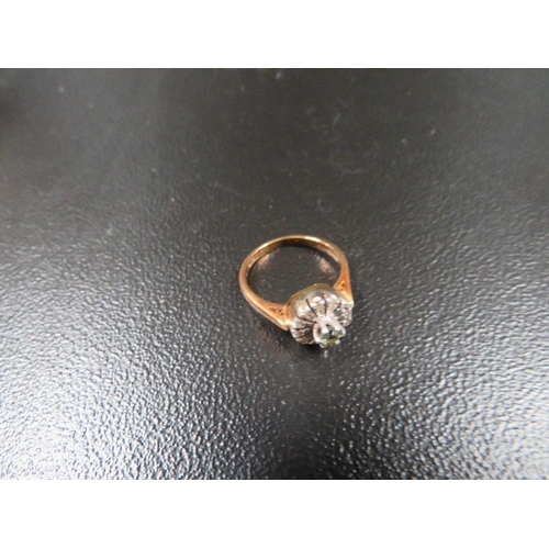 356 - A hallmarked 18ct gold ring set with an aquamarine stone surrounding with diamonds approx. weight 4.... 