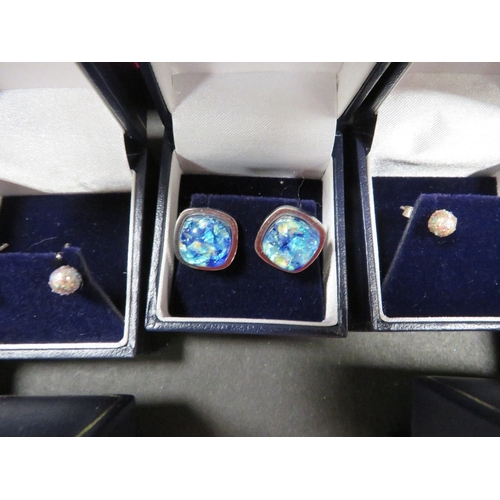 404 - Five boxed pairs of silver earrings etc, together with a loose pair of earrings and a ring