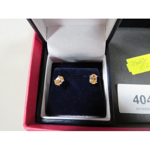 404 - Five boxed pairs of silver earrings etc, together with a loose pair of earrings and a ring