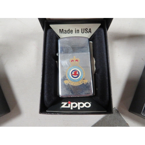 410 - Three boxed zippo RAF squadron lighters 51st, 26th squadrons and Goose bay (3) and a new wick in pac... 