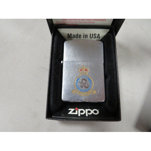 410 - Three boxed zippo RAF squadron lighters 51st, 26th squadrons and Goose bay (3) and a new wick in pac... 