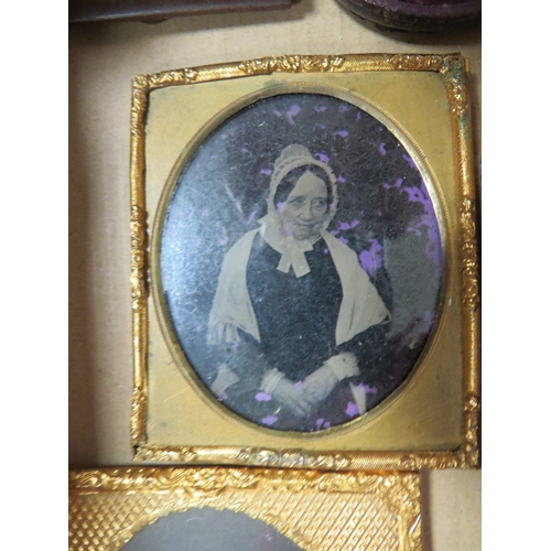 420 - A selection of vintage daguerreotypes, frames etc, to include an unusual ambrotype holder in the for... 