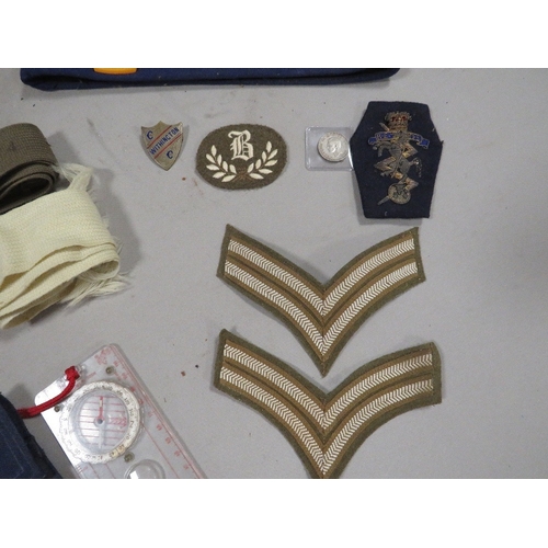 444 - A Military paperweight, badges etc