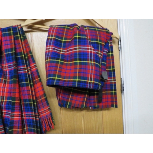 463 - Three kilts to include two McPherson kilts and a Blackwatch kilt - size 34