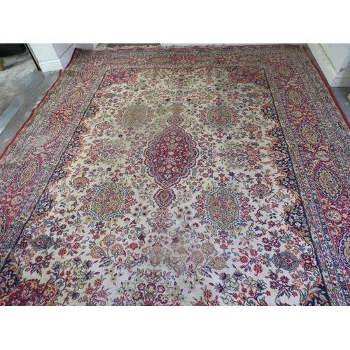 800 - A large woollen carpet approx. 276 x 276 cm