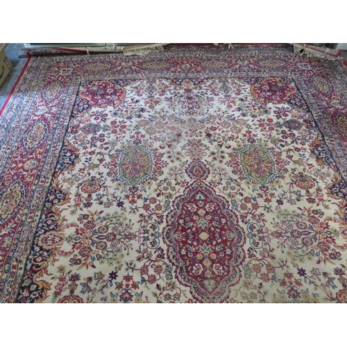 800 - A large woollen carpet approx. 276 x 276 cm