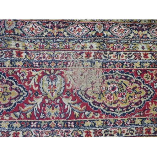 800 - A large woollen carpet approx. 276 x 276 cm