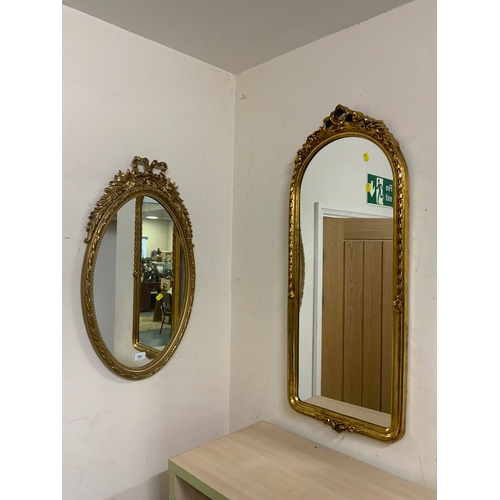 701 - Three modern gilt wall mirrors including an oval example. (3)