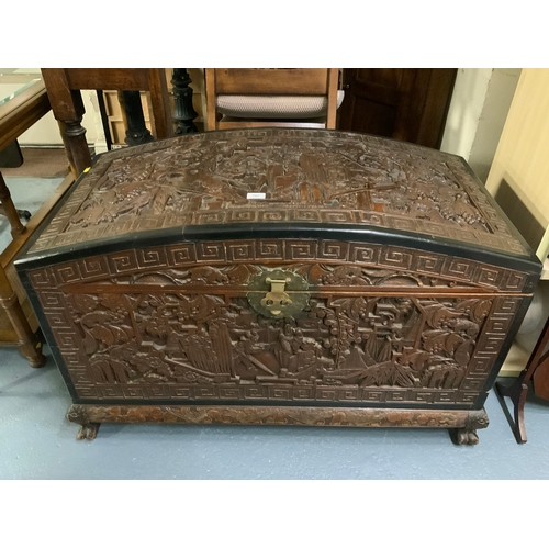 702 - A large Eastern carved camphor wood domed chest W 105 cm