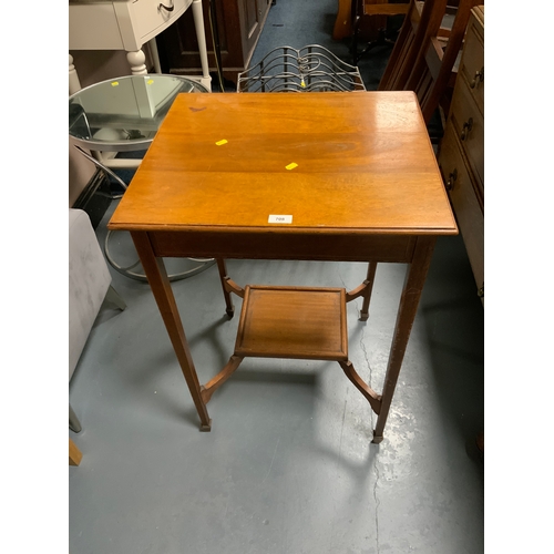 708 - An Edwardian mahogany two tier occasional table