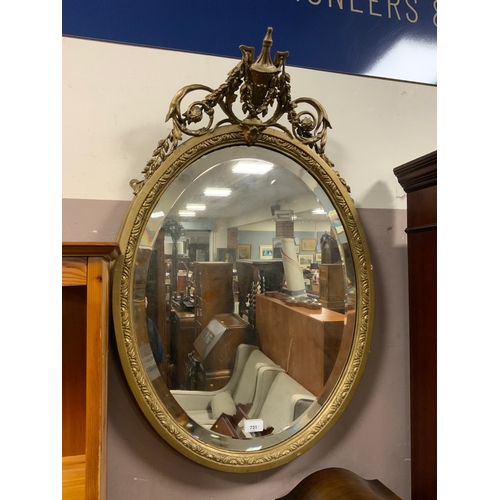 731 - An antique gilt wall mirror with vase surmount H 80 cm