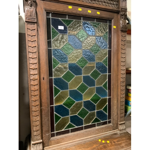 734 - A Victorian oak glazed and leaded carved cupboard with lion mask detail H 235 cm W 92 cm