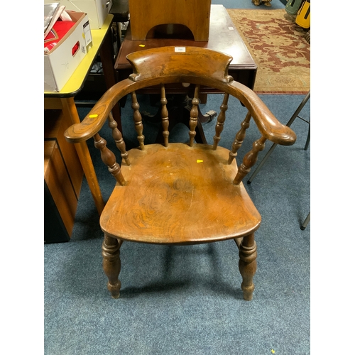 735 - An antique elm smokers bow armchair